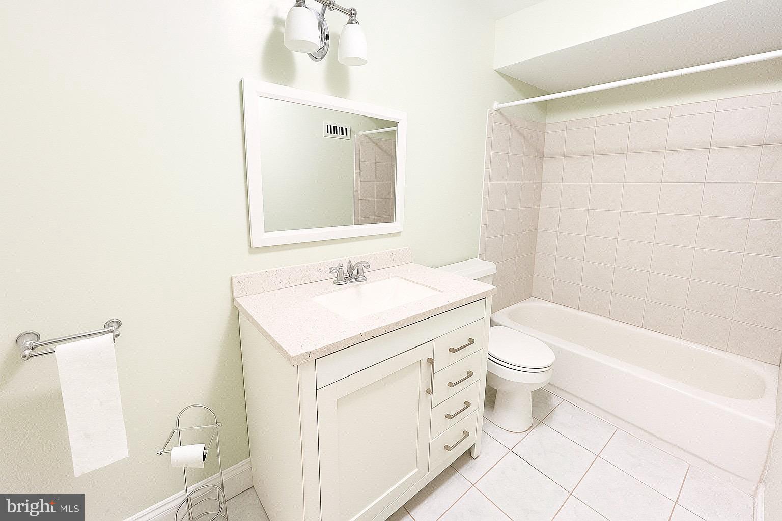 5909 Prince James Drive, Unit D Springfield, VA 22152 - Photo 10 of 18 a bathroom with a sink a toilet and shower
