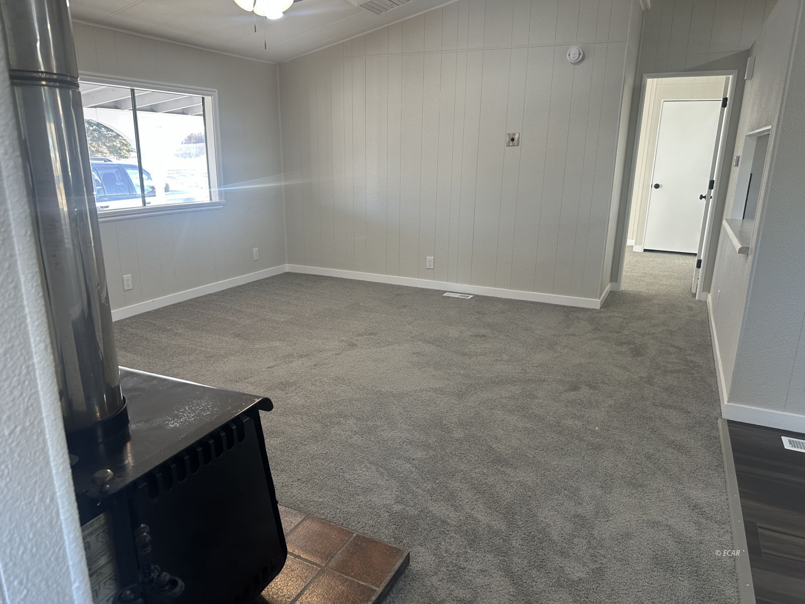 940 Spring Valley Parkway Spring Creek, NV 89815 - Photo 10 of 25 an empty room with windows