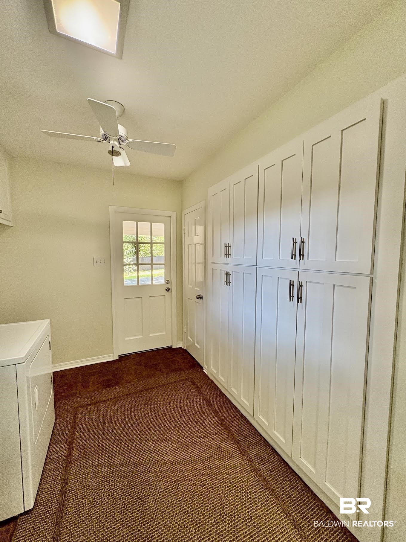 6105 Brandy Run Road South Mobile, AL 36608 - Photo 12 of 45 Doorway to outside with dark colored carpet, baseboards, and a ceiling fan