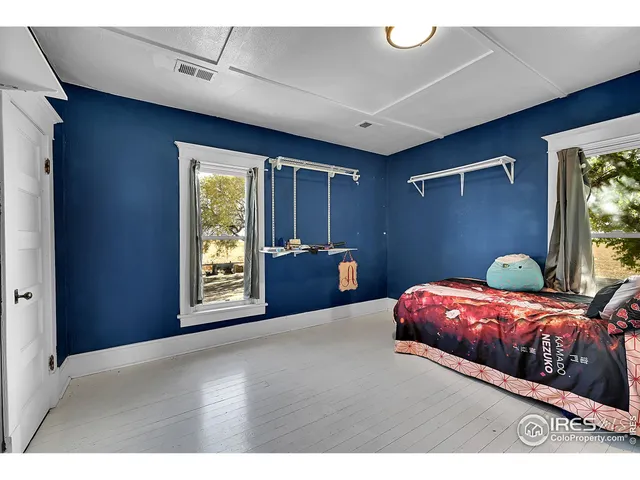 a bathroom with a shower a mirror and a sink