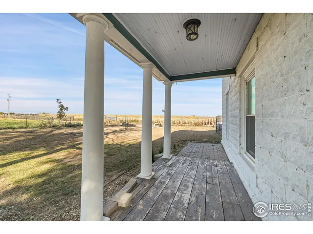 a living room with furniture wooden floor and a flat screen tv