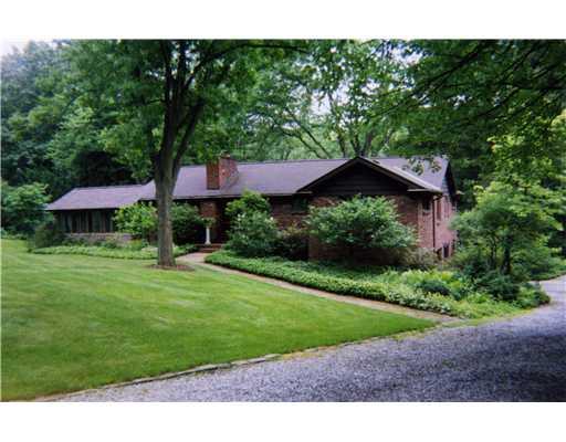 825 Old Mill Road Fox Chapel, PA 15238 - Photo 1 of 17 Exterior Front. Nestled amid 1.5 private acres, this brick and cedar ranch blends luxury, privacy and meticulous upkeep.