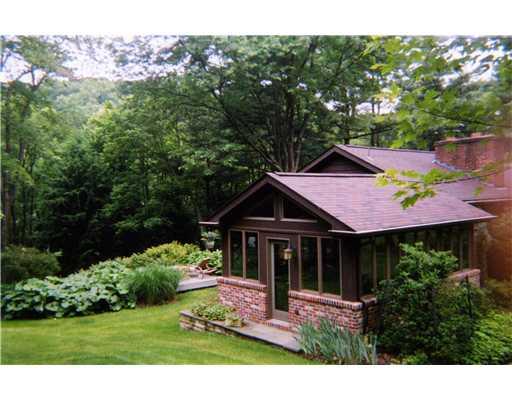 825 Old Mill Road Fox Chapel, PA 15238 - Photo 15 of 17 Exterior Front. Beyond the sunroom, the sundeck offers seclusion and scenic wooded views.