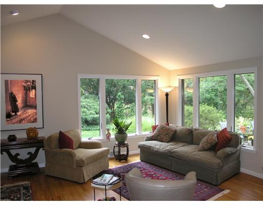 825 Old Mill Road Fox Chapel, PA 15238 - Photo 3 of 17 Living Room. The light and bright living room, with vaulted ceiling, is underscored in hardwood and features large windows that frame beautiful wooded views.