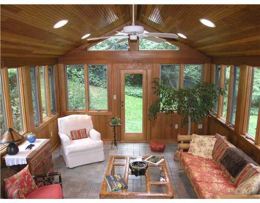 825 Old Mill Road Fox Chapel, PA 15238 - Photo 6 of 17 Sunroom. The inviting sunroom features radiant floor heating, multiple Andersen windows, a vaulted pine ceiling and access to the exterior.