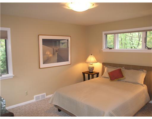 825 Old Mill Road Fox Chapel, PA 15238 - Photo 10 of 17 Master Bedroom. Corner windows allow for yet additional views of the beautiful outdoors.