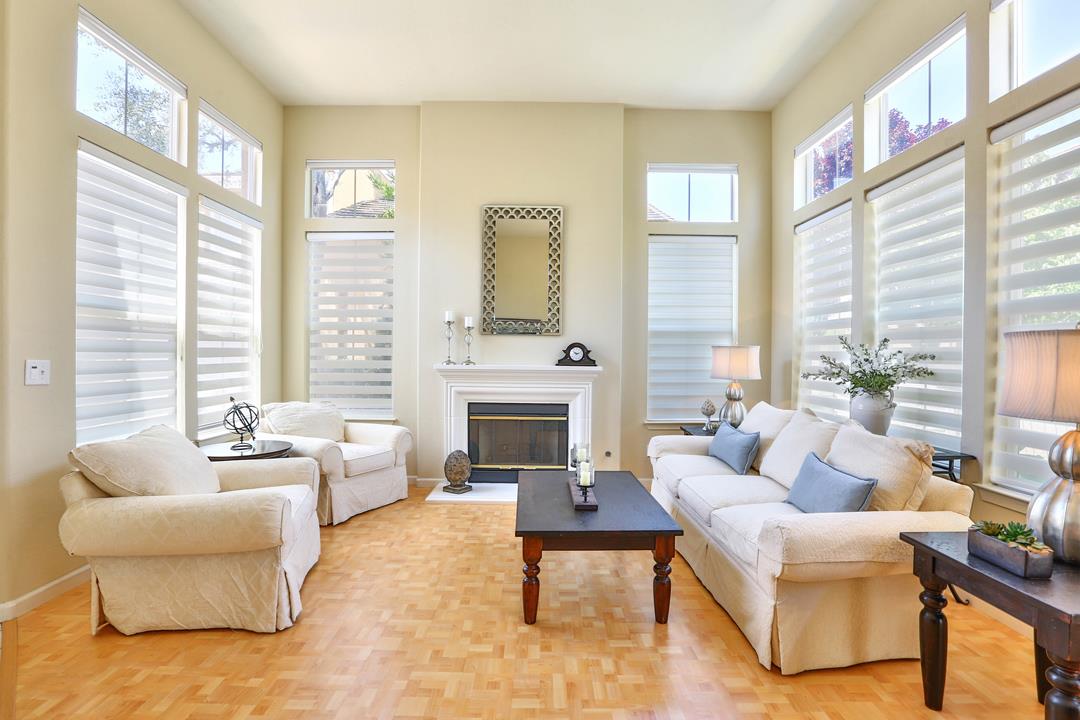 5769 Chambertin Drive San Jose, CA 95118 - Photo 2 of 8 a living room with furniture and a fireplace