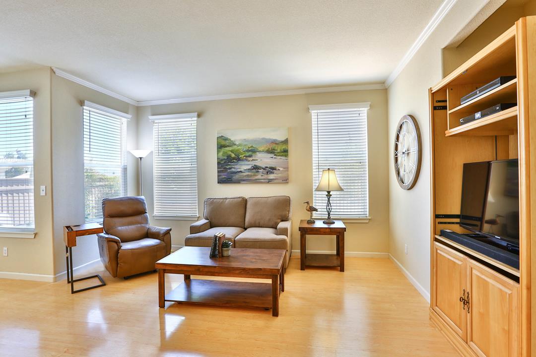 5769 Chambertin Drive San Jose, CA 95118 - Photo 4 of 8 a living room with furniture and a large window