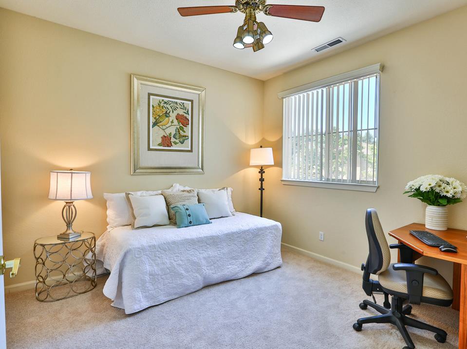 5769 Chambertin Drive San Jose, CA 95118 - Photo 6 of 8 a living room with a bed furniture and a window