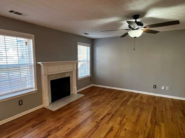 3721 Bogan Mill Road Northeast Buford, GA 30519 - Photo 12 of 41 a view of an empty room with wooden floor fireplace and a window