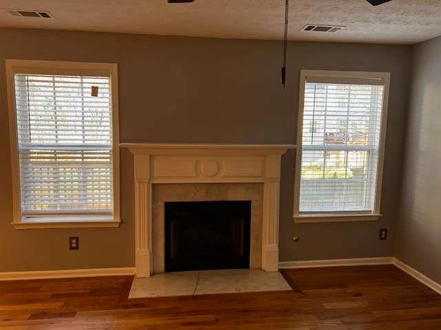 3721 Bogan Mill Road Northeast Buford, GA 30519 - Photo 15 of 41 a living room with a fireplace and a window