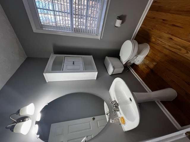 3721 Bogan Mill Road Northeast Buford, GA 30519 - Photo 17 of 41 a bathroom with a toilet sink and mirror