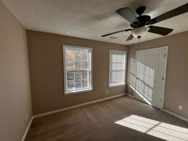 3721 Bogan Mill Road Northeast Buford, GA 30519 - Photo 20 of 41 a view of an empty room with a window