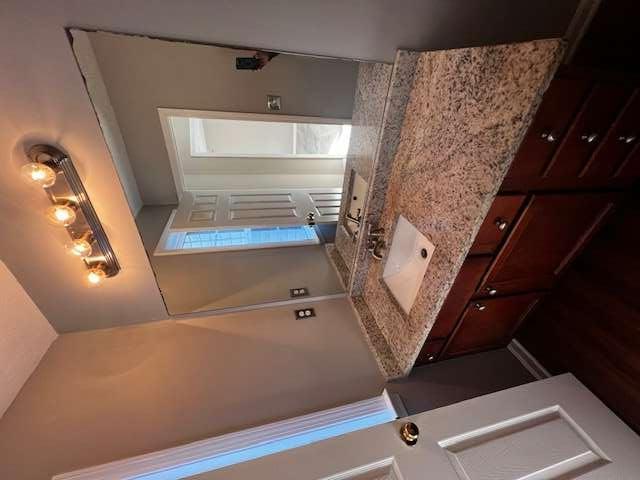 3721 Bogan Mill Road Northeast Buford, GA 30519 - Photo 27 of 41 a bathroom with a granite countertop sink and a mirror