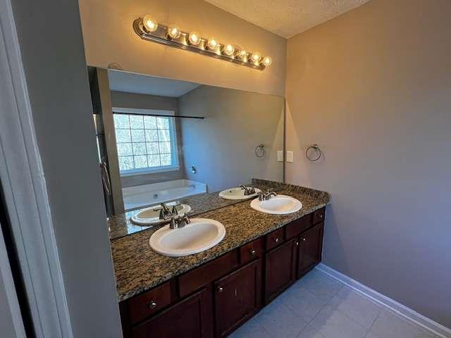 3721 Bogan Mill Road Northeast Buford, GA 30519 - Photo 31 of 41 a bathroom with a granite countertop sink a mirror and a vanity