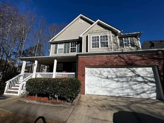 3721 Bogan Mill Road Northeast Buford, GA 30519 - Photo 4 of 41 a front view of a house with a yard