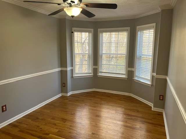 3721 Bogan Mill Road Northeast Buford, GA 30519 - Photo 9 of 41 a view of an empty room with wooden floor and a window