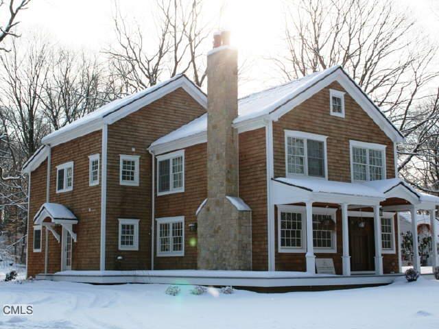 161 Compo Road South Westport, CT 06880 - Photo 1 of 1 a front view of a house with yard and trees