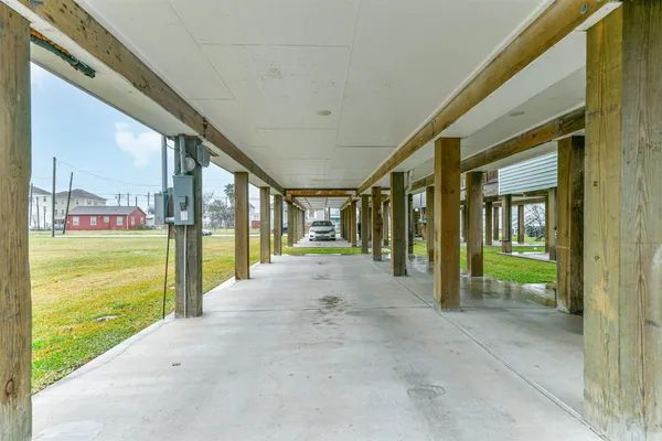 a view of a house with porch and a yard