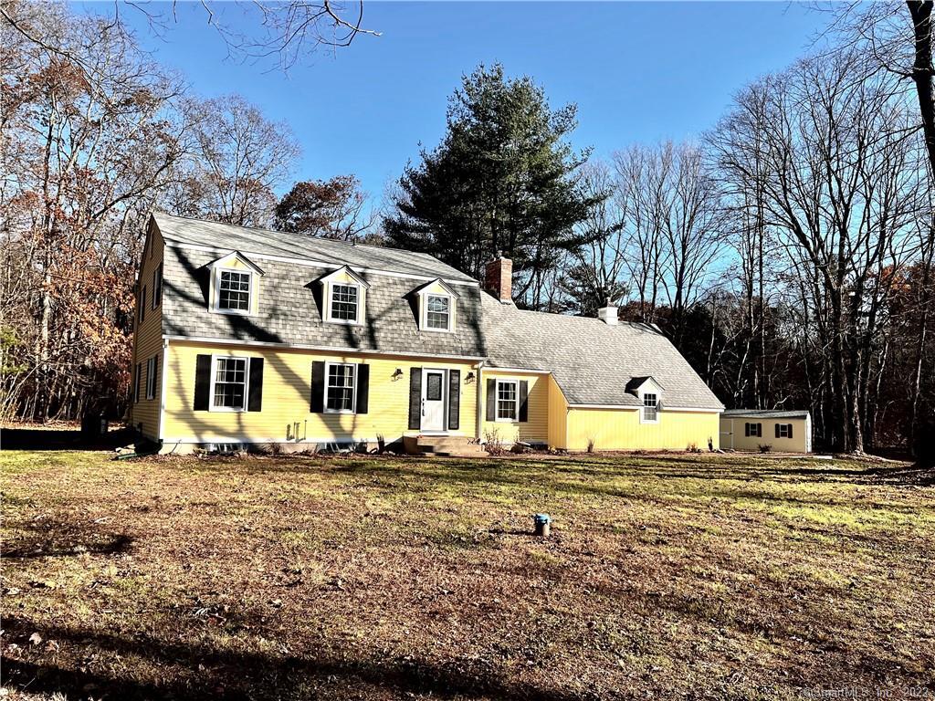 Set well back from the road for privacy this traditional Dutch colonial is a welcoming retreat.