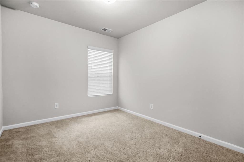 3181 Meadowstone Lane Southwest Atlanta, GA 30331 - Photo 20 of 27 an empty room with a window