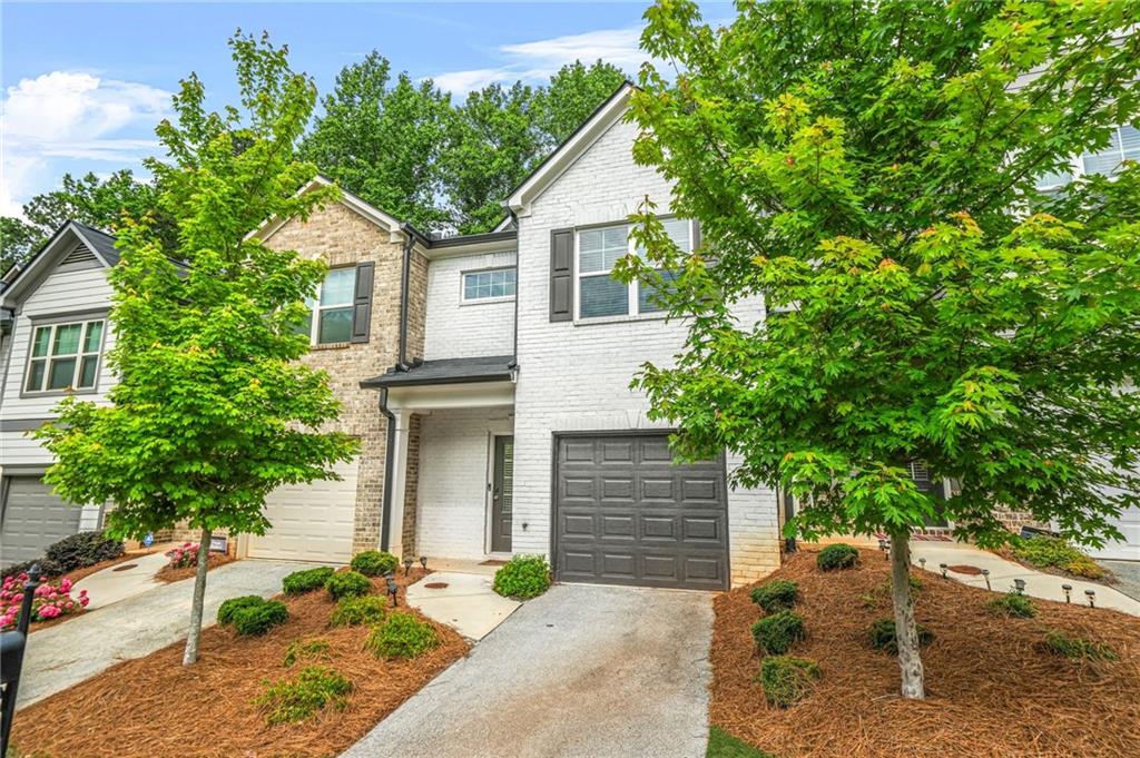 3181 Meadowstone Lane Southwest Atlanta, GA 30331 - Photo 2 of 27 a front view of a house with a yard