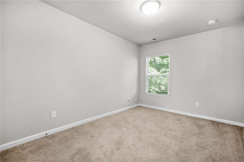 3181 Meadowstone Lane Southwest Atlanta, GA 30331 - Photo 22 of 27 an empty room with windows