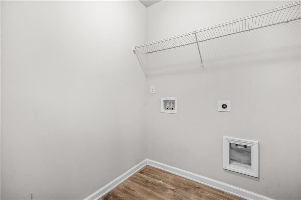 3181 Meadowstone Lane Southwest Atlanta, GA 30331 - Photo 25 of 27 a view of a room with racks on the wall