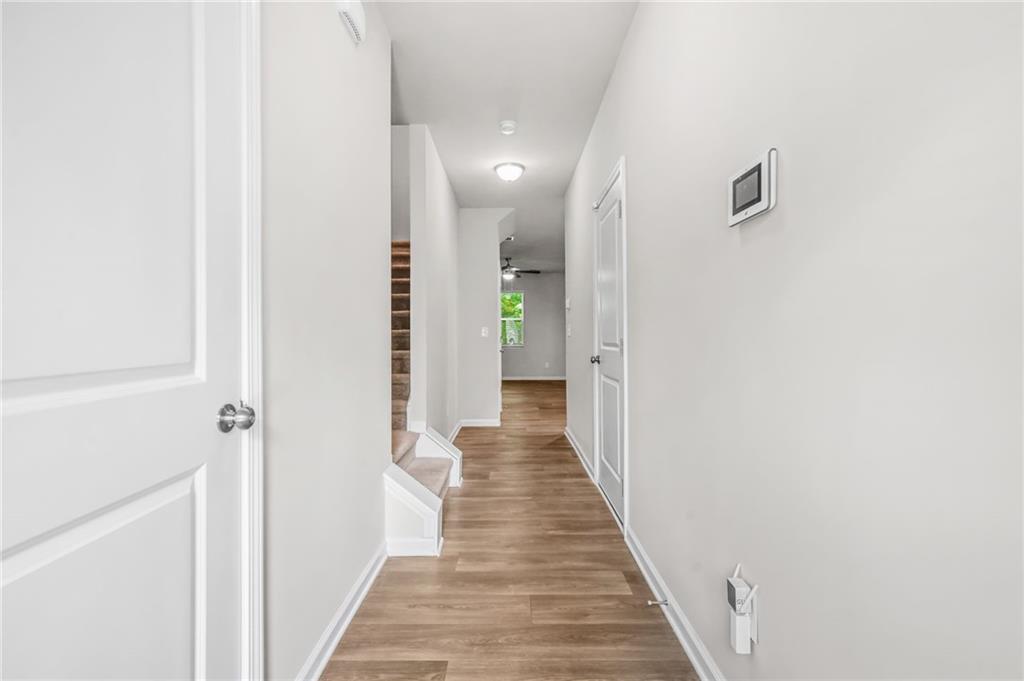 3181 Meadowstone Lane Southwest Atlanta, GA 30331 - Photo 3 of 27 a view of a hallway with wooden floor