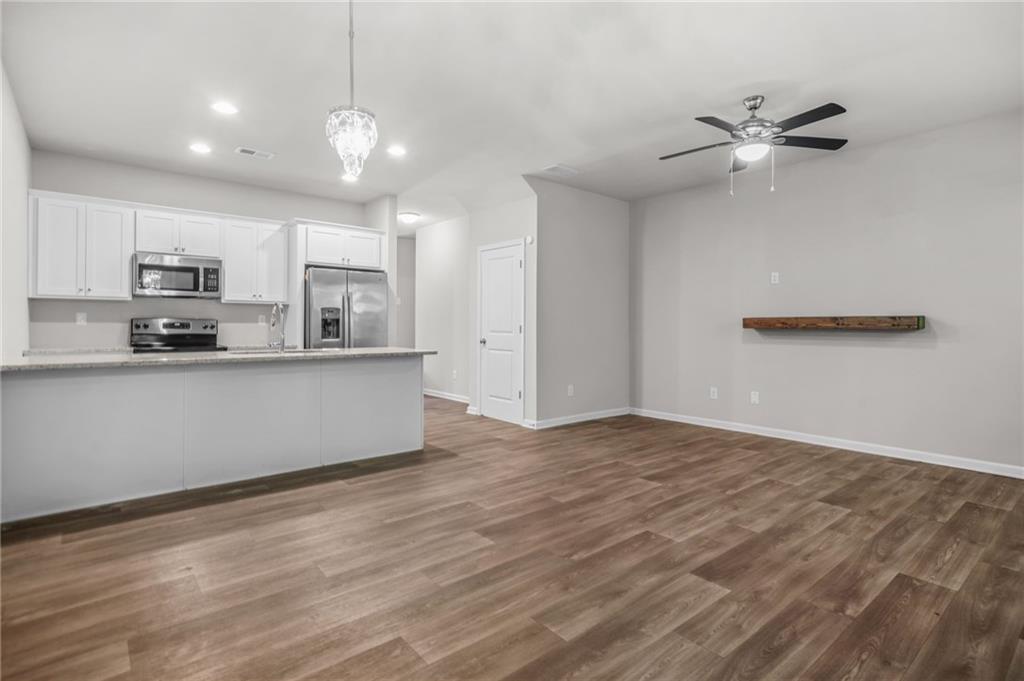 3181 Meadowstone Lane Southwest Atlanta, GA 30331 - Photo 4 of 27 a view of kitchen with wooden floor and window