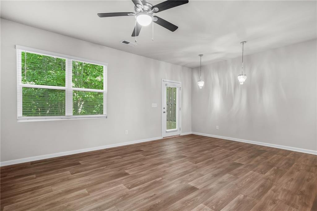 3181 Meadowstone Lane Southwest Atlanta, GA 30331 - Photo 6 of 27 wooden floor in an empty room with a window