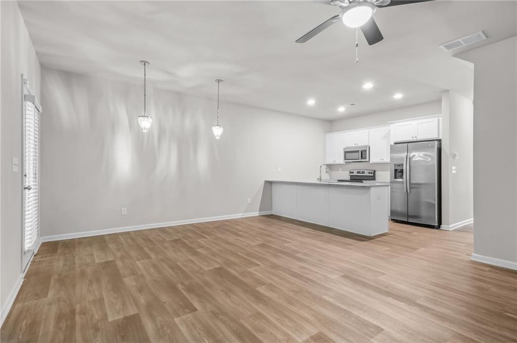 3181 Meadowstone Lane Southwest Atlanta, GA 30331 - Photo 7 of 27 a view of kitchen with wooden floor
