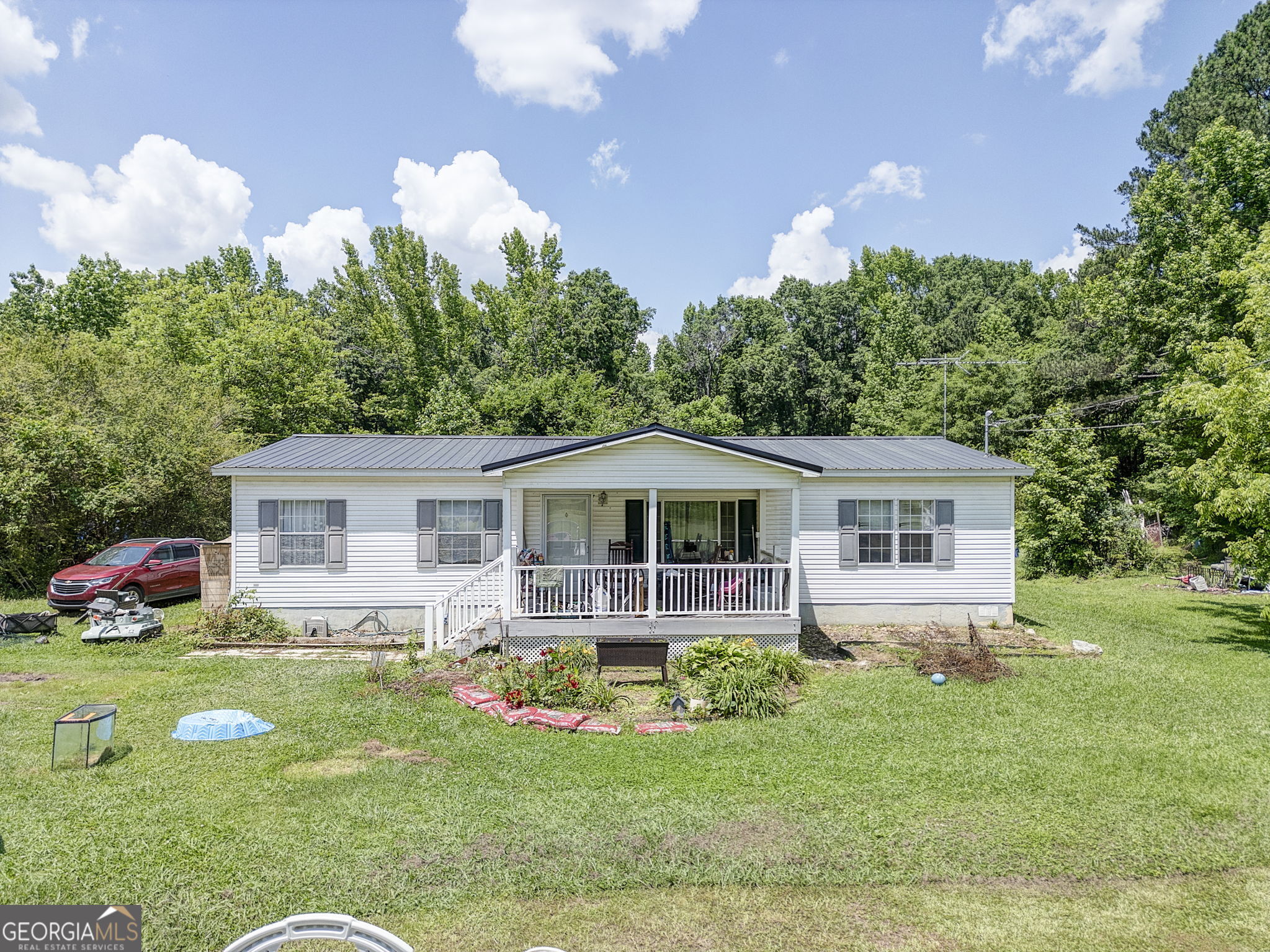 570 Grady Road Rockmart, GA 30153 - Photo 1 of 1 a front view of house with yard and green space