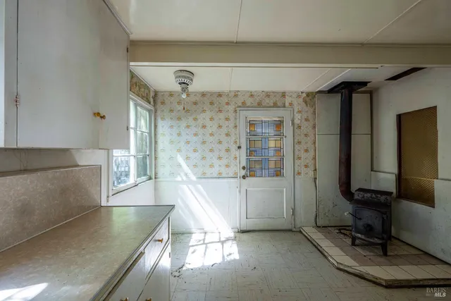 a view of a living room with a large window