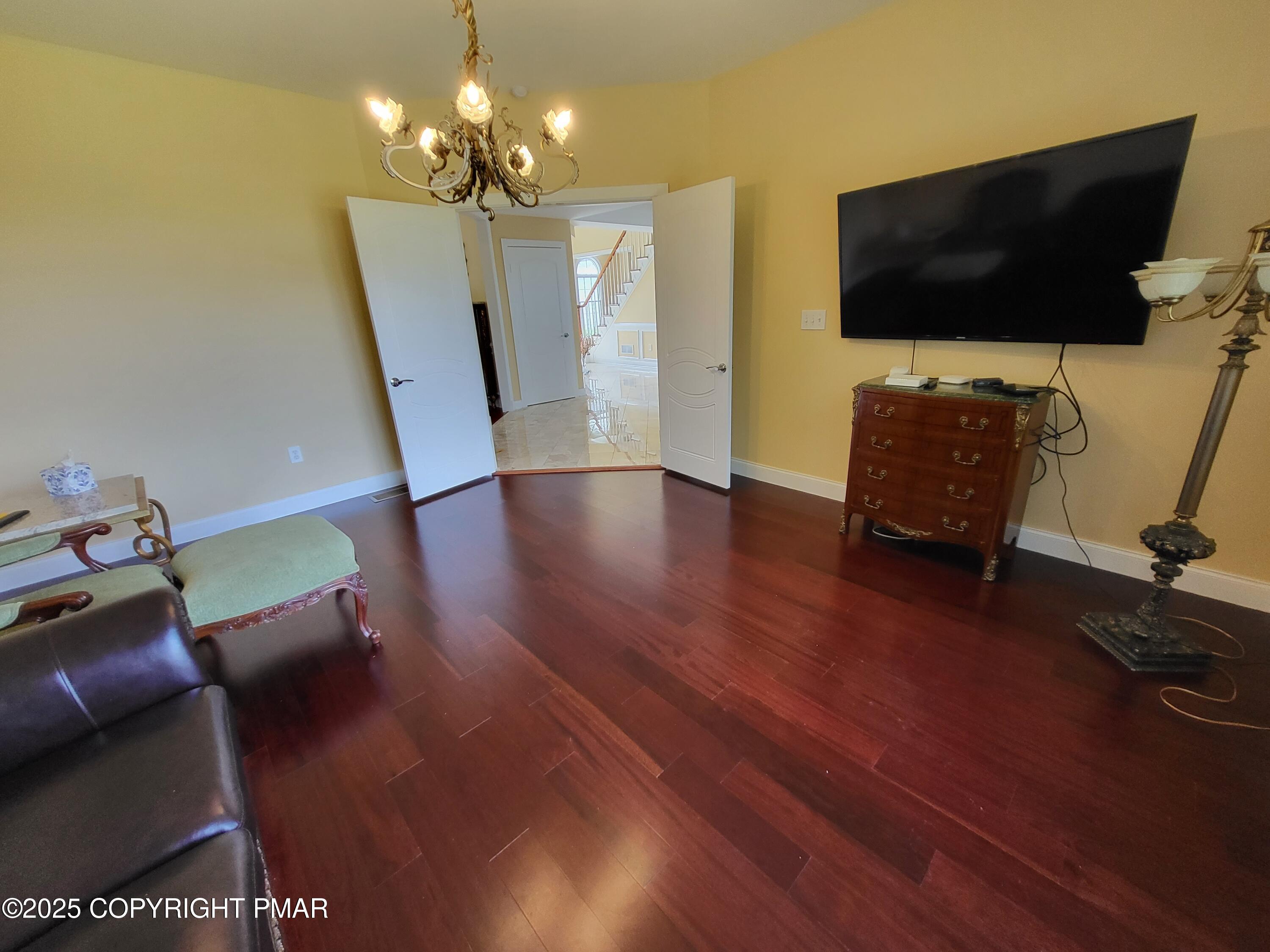 229 Rising Meadow Way East Stroudsburg, PA 18302 - Photo 22 of 73 a living room with furniture and a flat screen tv