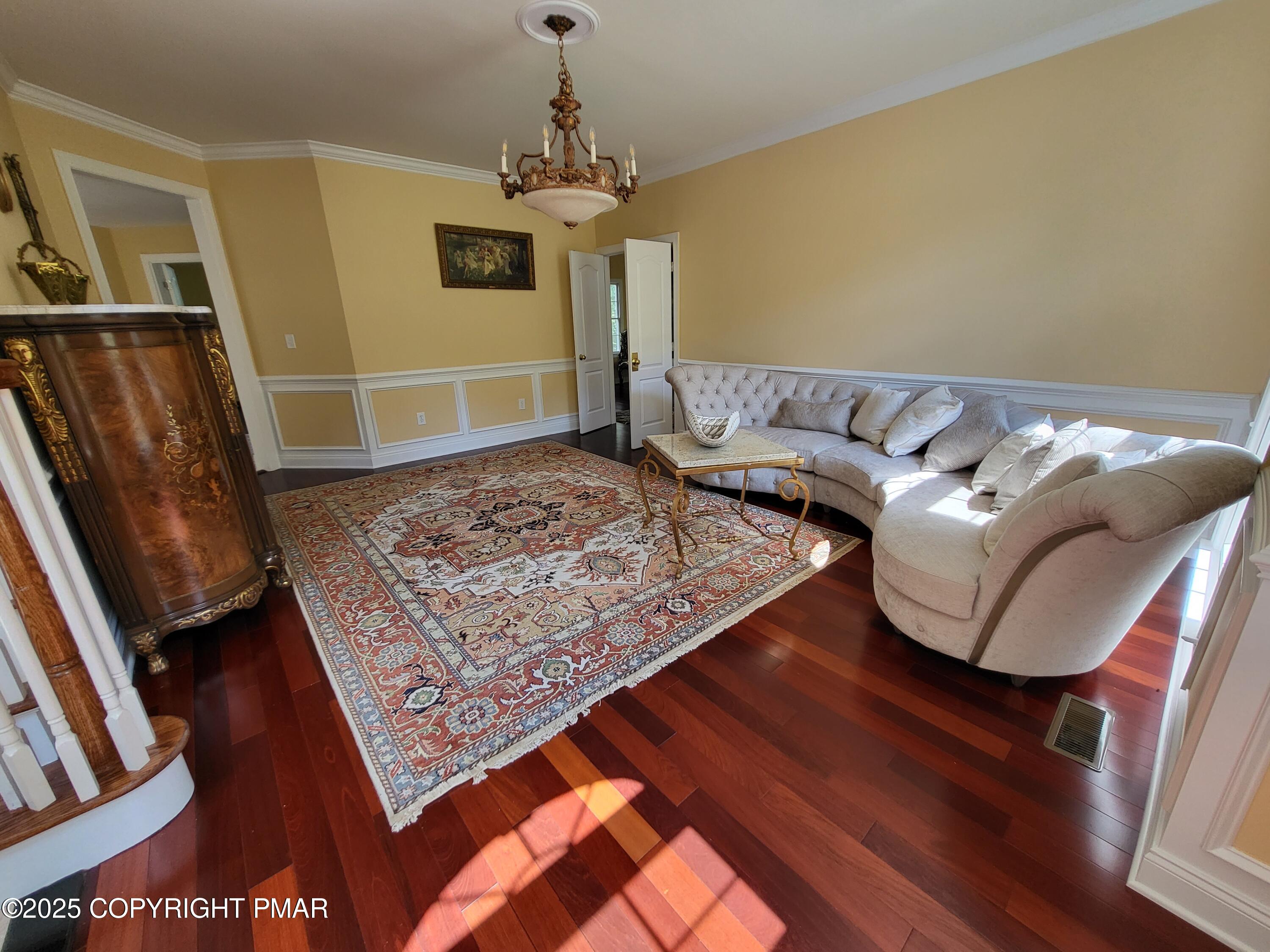229 Rising Meadow Way East Stroudsburg, PA 18302 - Photo 24 of 73 a living room with a couch and wooden floor