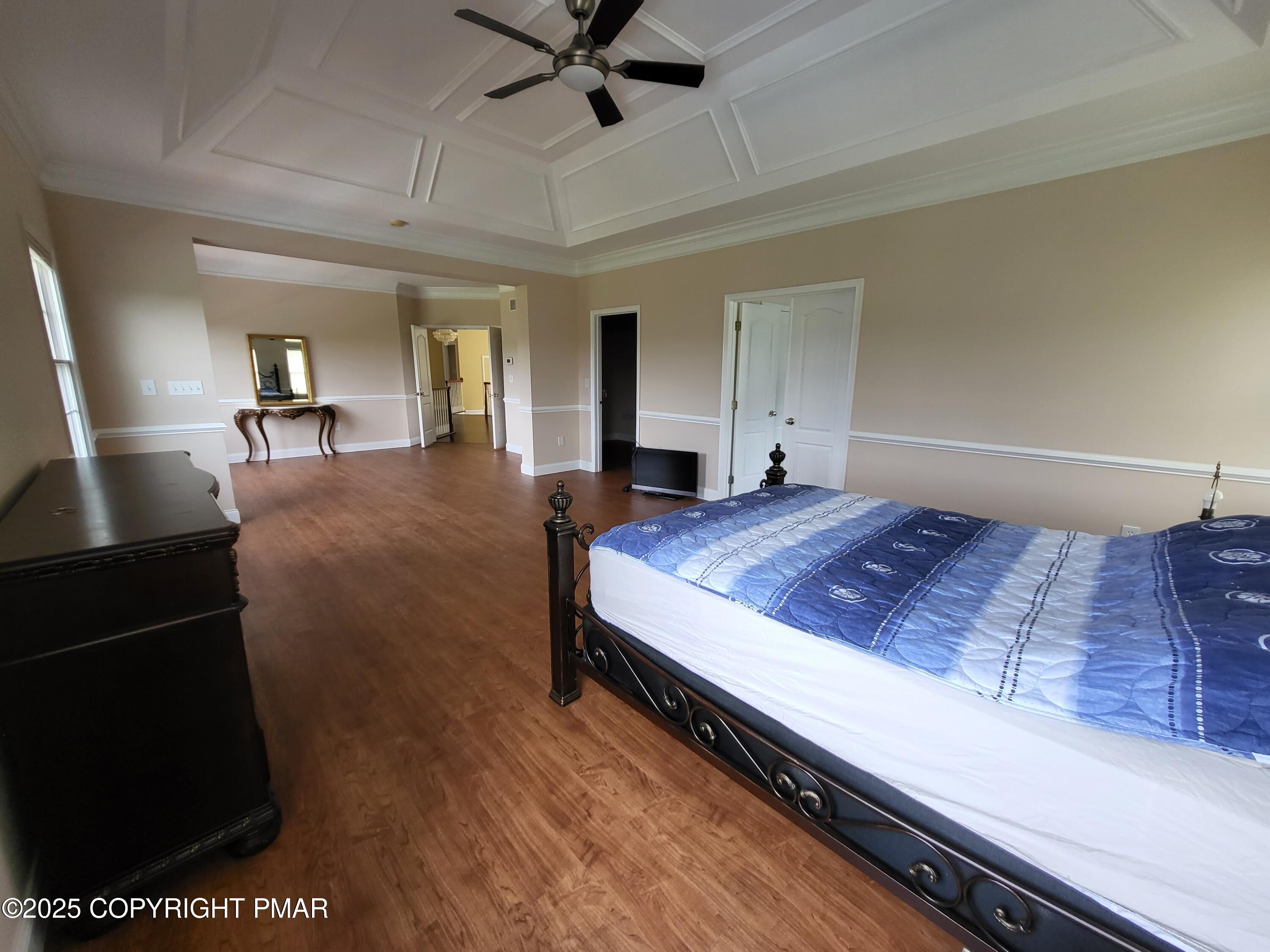 229 Rising Meadow Way East Stroudsburg, PA 18302 - Photo 31 of 73 a living room with a bed furniture and a ceiling fan