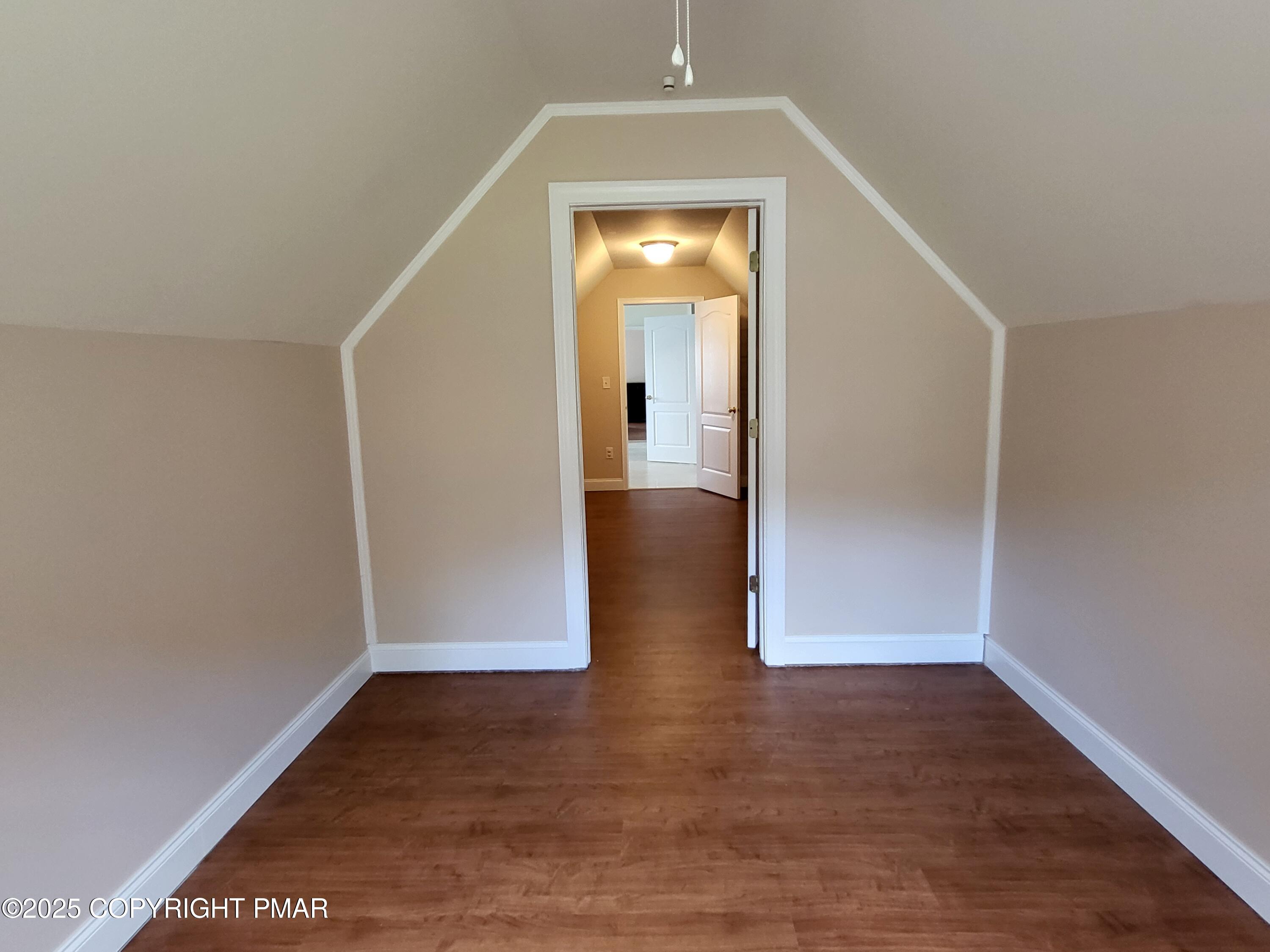 229 Rising Meadow Way East Stroudsburg, PA 18302 - Photo 32 of 73 wooden floor in an empty room with a gallery