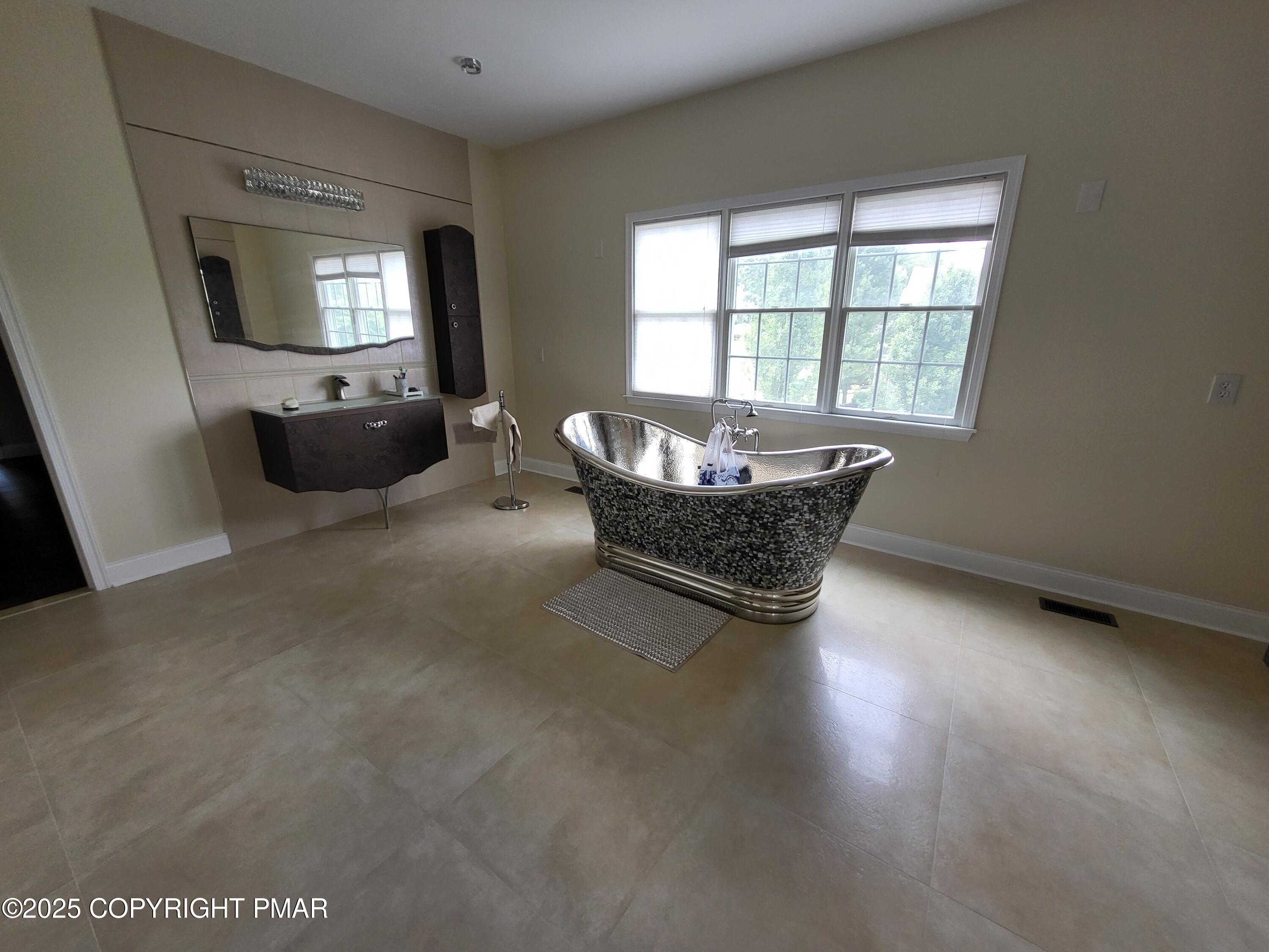 229 Rising Meadow Way East Stroudsburg, PA 18302 - Photo 39 of 73 a living room with furniture and a flat screen tv