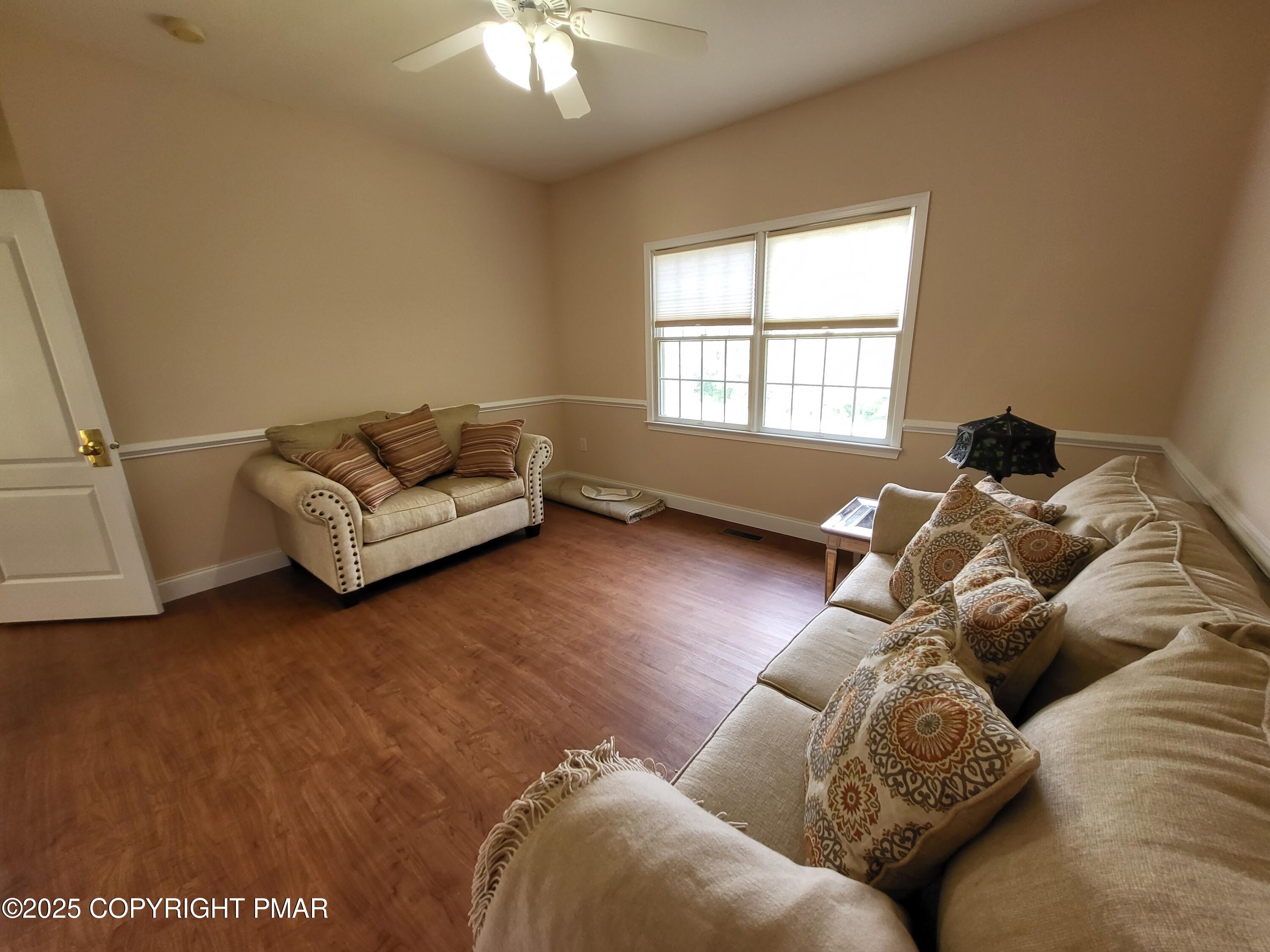 229 Rising Meadow Way East Stroudsburg, PA 18302 - Photo 44 of 73 a living room with furniture and a window