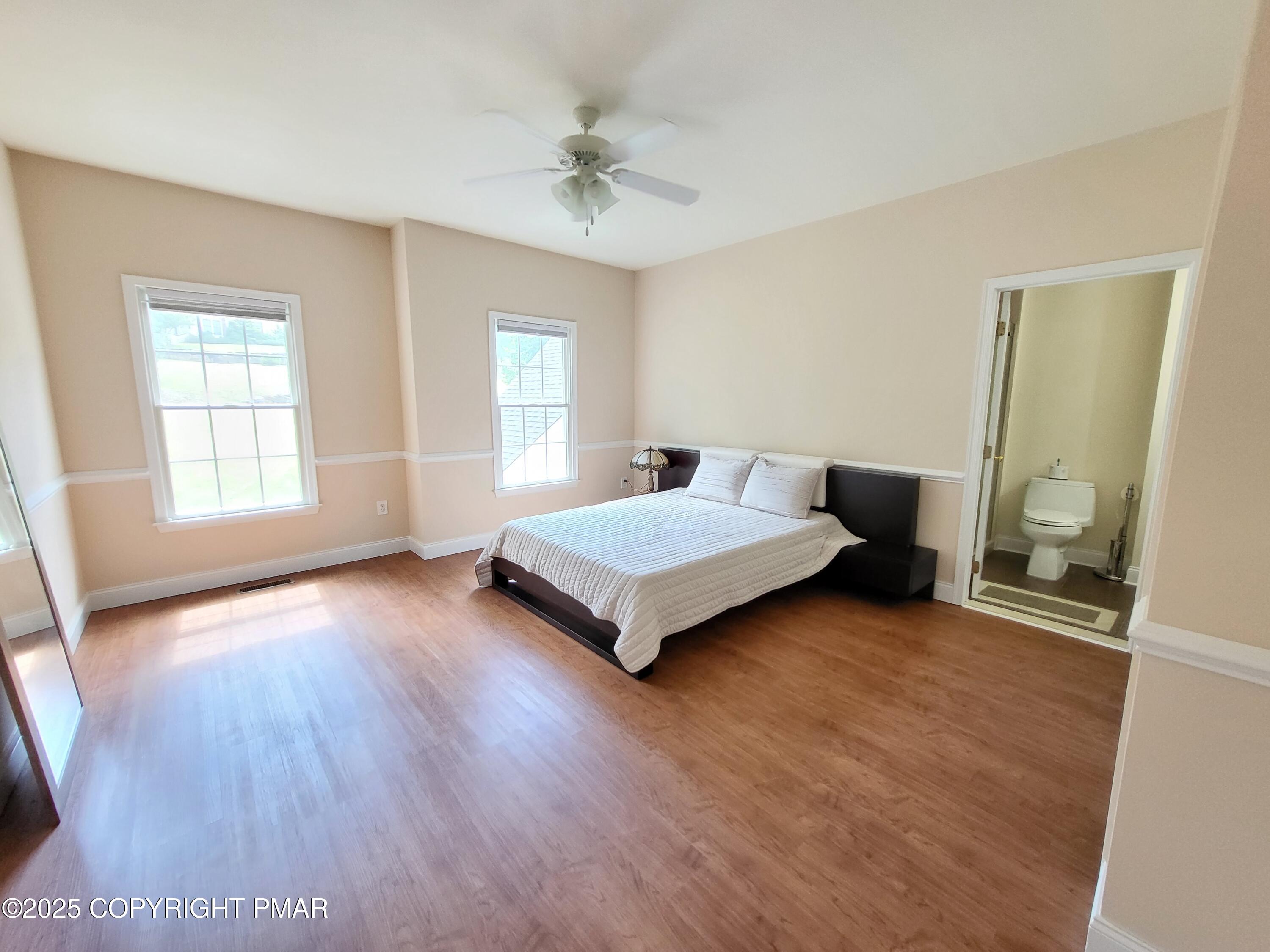 229 Rising Meadow Way East Stroudsburg, PA 18302 - Photo 46 of 73 a spacious bedroom with a bed and a window