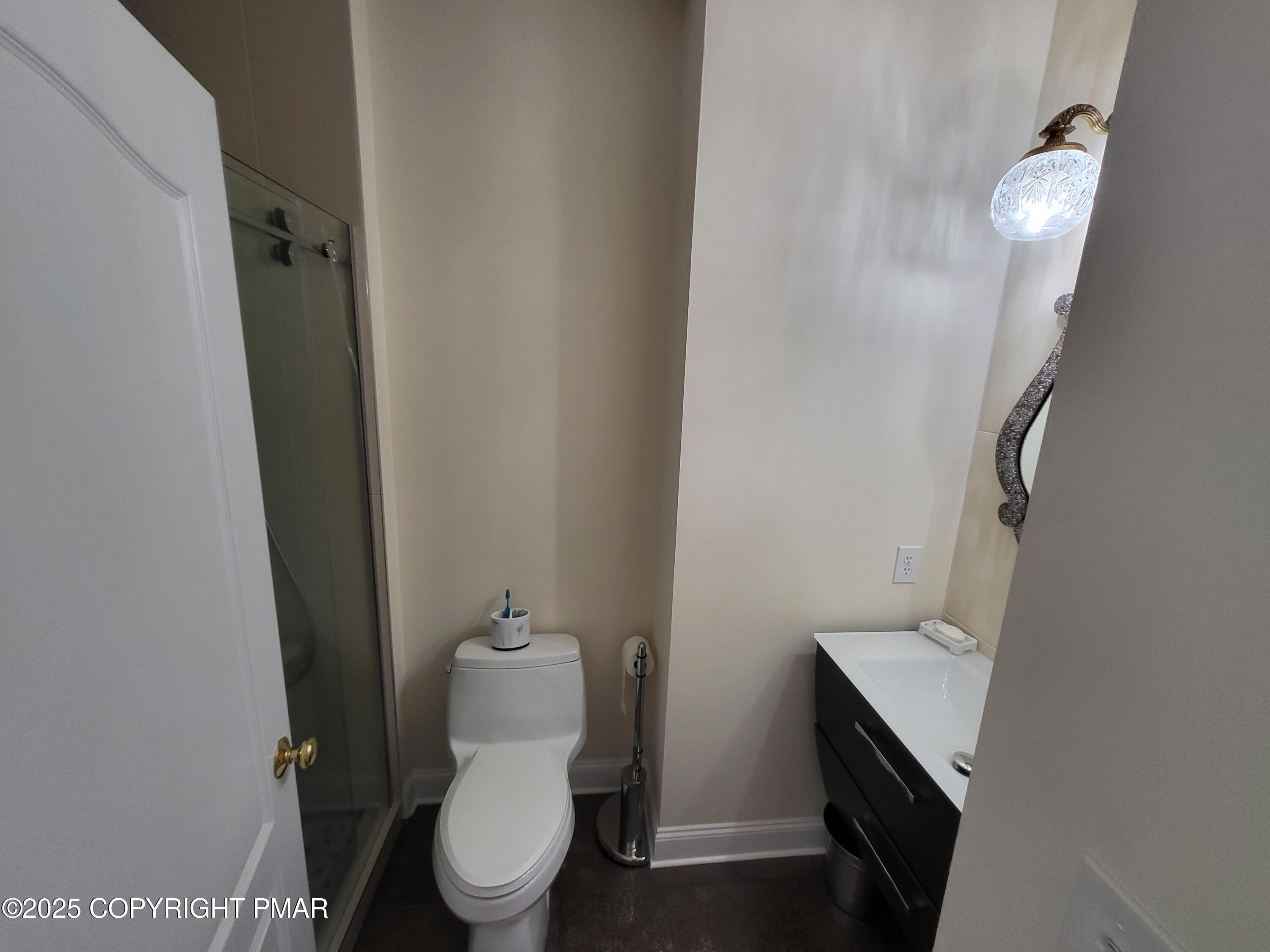 229 Rising Meadow Way East Stroudsburg, PA 18302 - Photo 48 of 73 a bathroom with a toilet and a sink