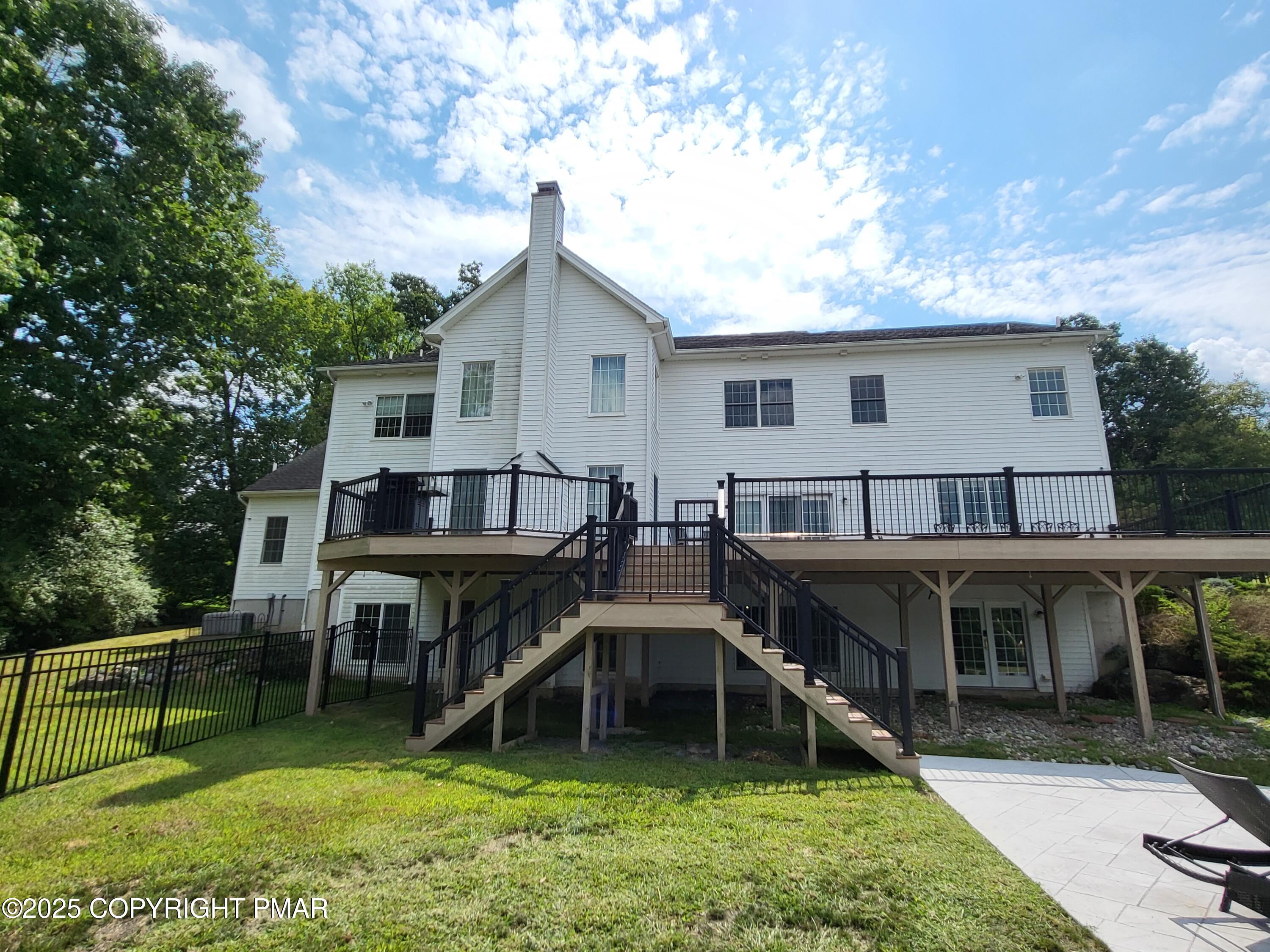 229 Rising Meadow Way East Stroudsburg, PA 18302 - Photo 54 of 73 a view of a house with a yard and sitting area