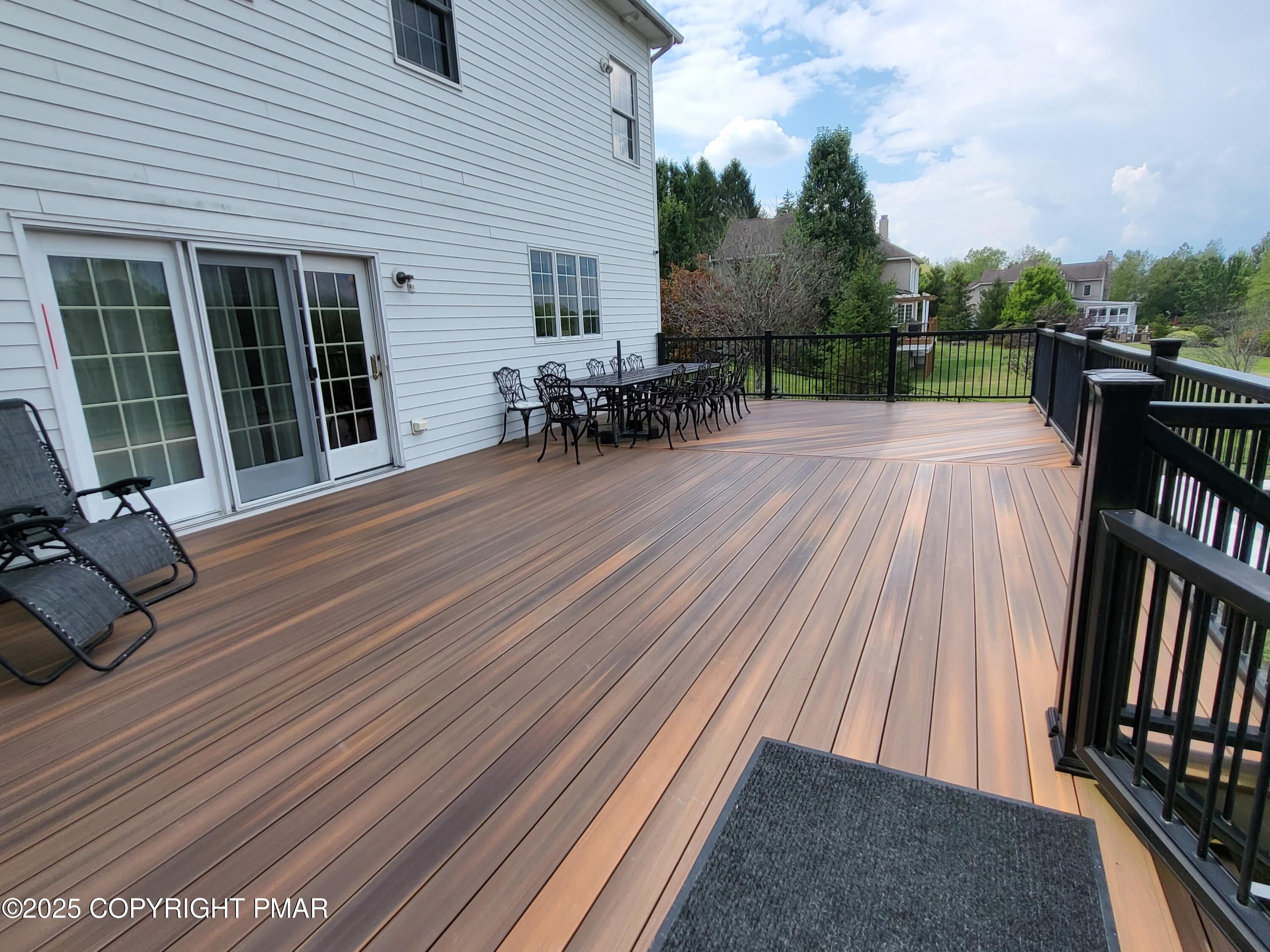 229 Rising Meadow Way East Stroudsburg, PA 18302 - Photo 59 of 73 a view of backyard with wheel chair potted plants and wooden floor
