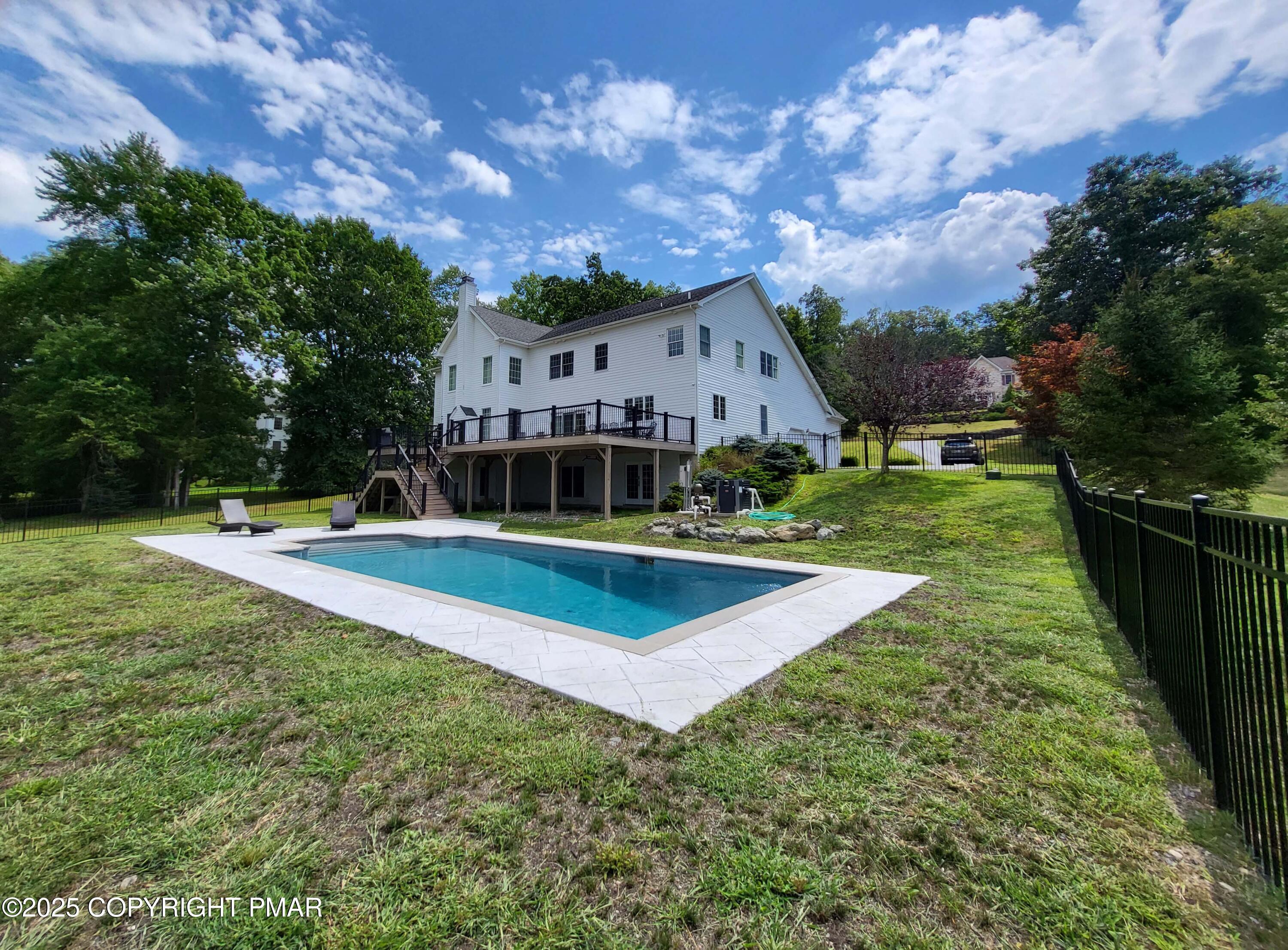 229 Rising Meadow Way East Stroudsburg, PA 18302 - Photo 69 of 73 a view of a house with swimming pool and yard