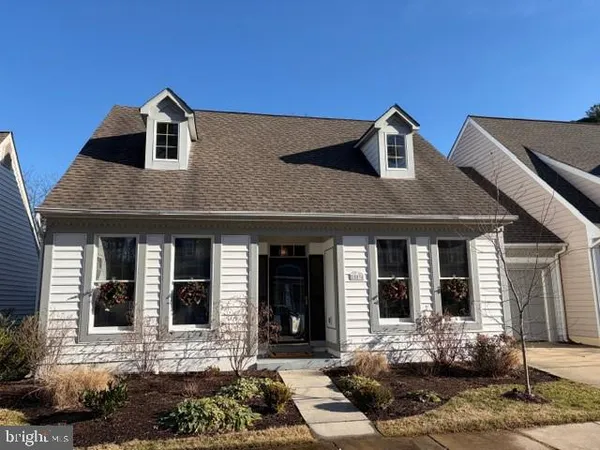 a front view of a house with yard