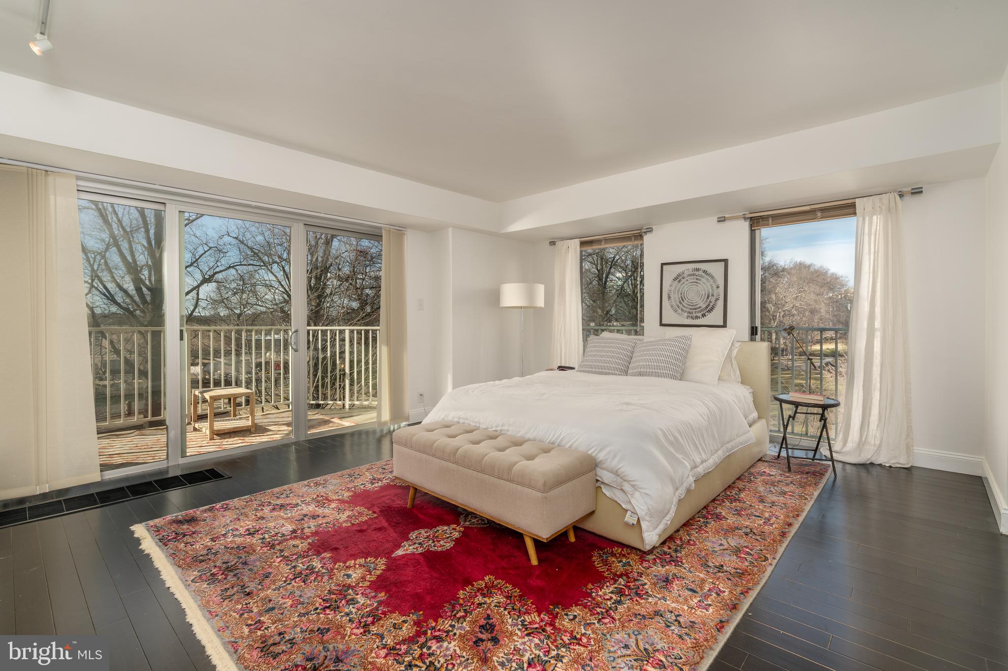 550 N Street Southwest, Unit S201 Washington, DC 20024 - Photo 23 of 63 a spacious bedroom with a large bed and a large window