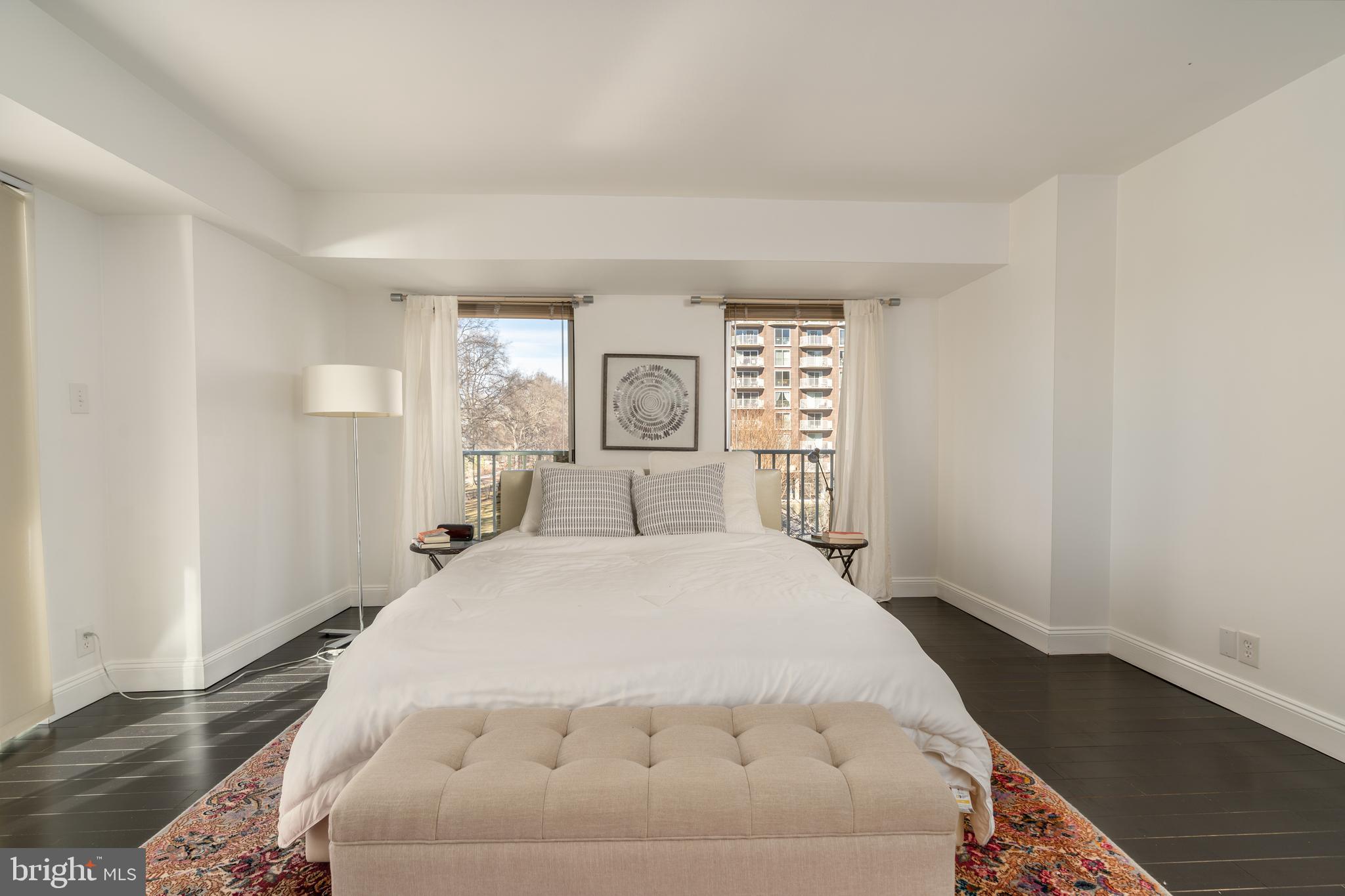 550 N Street Southwest, Unit S201 Washington, DC 20024 - Photo 24 of 63 a spacious bedroom with a bed and a window