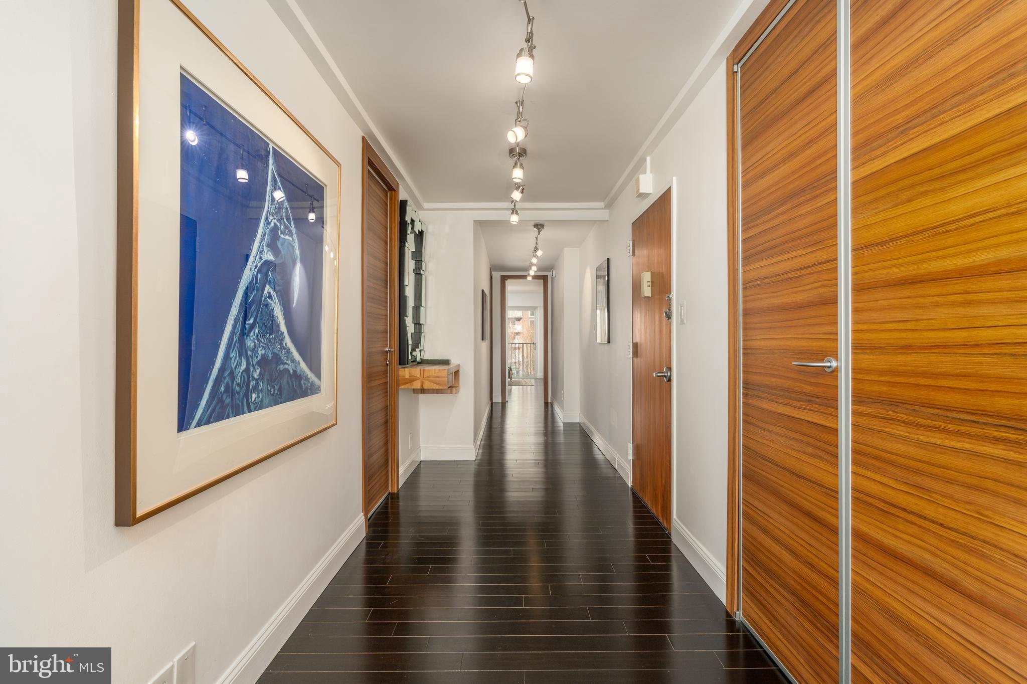 550 N Street Southwest, Unit S201 Washington, DC 20024 - Photo 3 of 63 a view of hallway with wooden floor and stairs