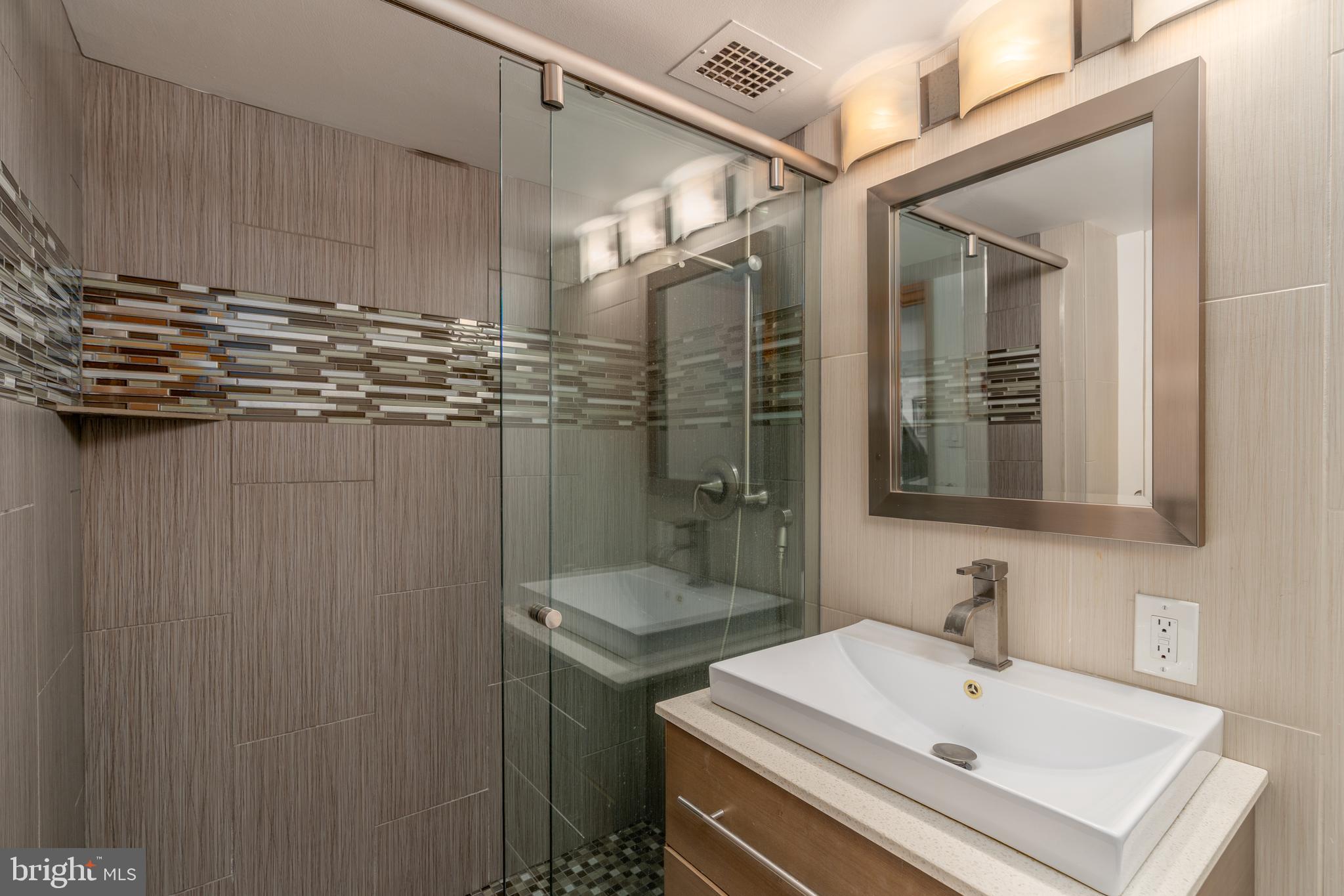 550 N Street Southwest, Unit S201 Washington, DC 20024 - Photo 33 of 63 a bathroom with a sink and a mirror